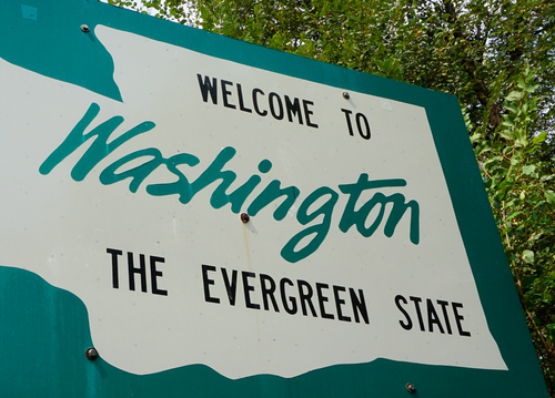 Highway sign stating "welcome to Washington, the Evergreen state"