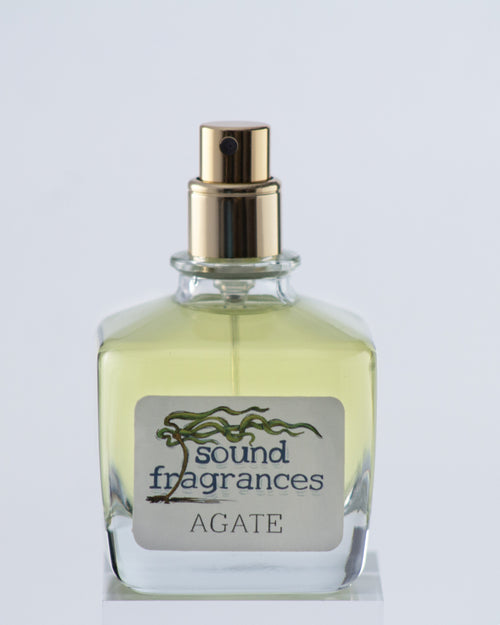 Agate perfume by Sound Fragrances, cold beach inspired Eau de Parfum bottle on gray background — artisan fragrance from the Pacific Northwest.