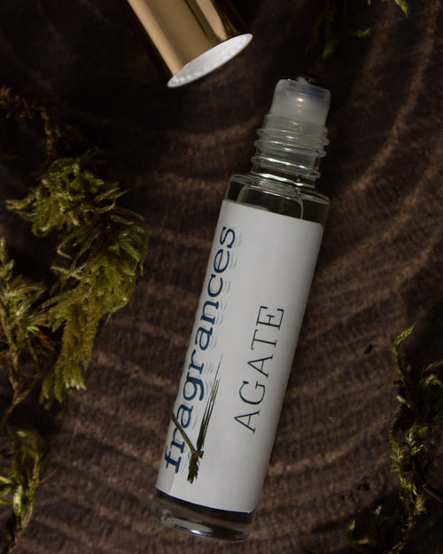 Agate perfume by Sound Fragrances, cold beach inspired Eau de Parfum mini bottle on wood surface with moss accents  — artisan fragrance from the Pacific Northwest.