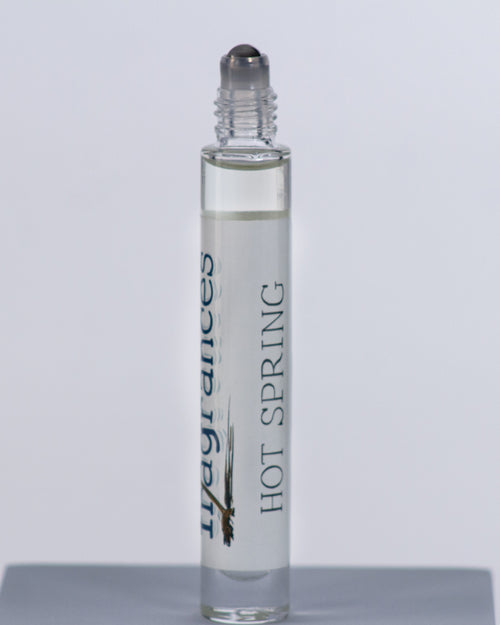 Hot Spring perfume by Sound Fragrances, thermal inspired Eau de Parfum travel roller bottle on gray background with — artisan fragrance from the Pacific Northwest.