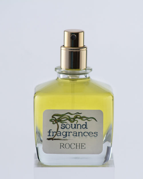 Roche perfume by Sound Fragrances, island-inspired Eau de Parfum bottle on gray background — artisan fragrance from the Pacific Northwest.