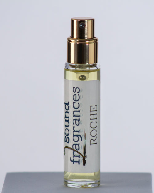 Roche perfume by Sound Fragrances, island-inspired Eau de Parfum travel bottle on gray background — artisan fragrance from the Pacific Northwest.