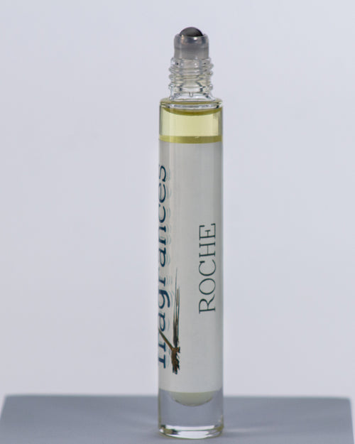 Roche perfume by Sound Fragrances, island inspired Eau de Parfum travel roller bottle on gray background — artisan fragrance from the Pacific Northwest.
