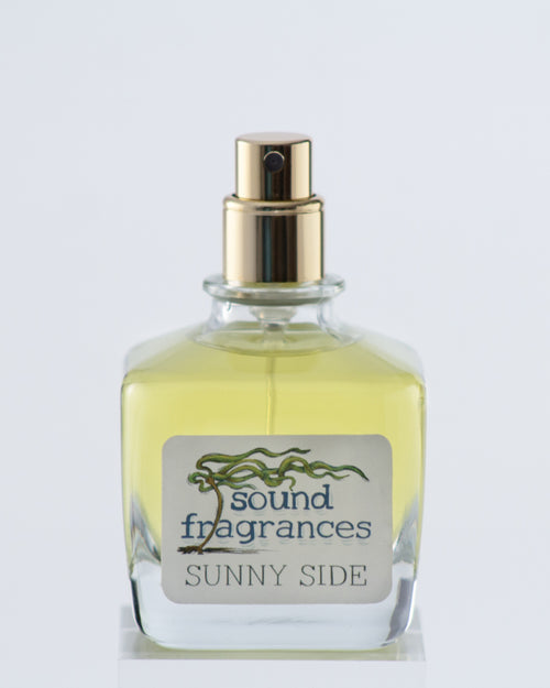 Sunny Side perfume by Sound Fragrances, forest inspired Eau de Parfum bottle on gray background — artisan fragrance from the Pacific Northwest.