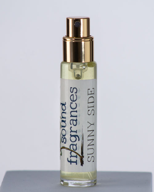 Sunny Side perfume by Sound Fragrances, forest inspired Eau de Parfum travel bottle on gray background — artisan fragrance from the Pacific Northwest.