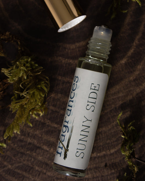 Grit perfume by Sound Fragrances, forest inspired Eau de Parfum mini bottle on wood surface with moss accents  — artisan fragrance from the Pacific Northwest.