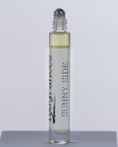 Sunny Side perfume by Sound Fragrances, forest inspired Eau de Parfum travel bottle on gray background — artisan fragrance from the Pacific Northwest.