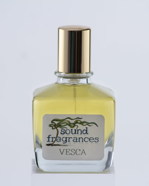 Vesca perfume by Sound Fragrances, berry-inspired Eau de Parfum bottle on gray background with gold lid — artisan fragrance from the Pacific Northwest.