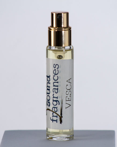 Vesca perfume by Sound Fragrances, berry-inspired Eau de Parfum bottle on gray background with gold lid — artisan fragrance from the Pacific Northwest.